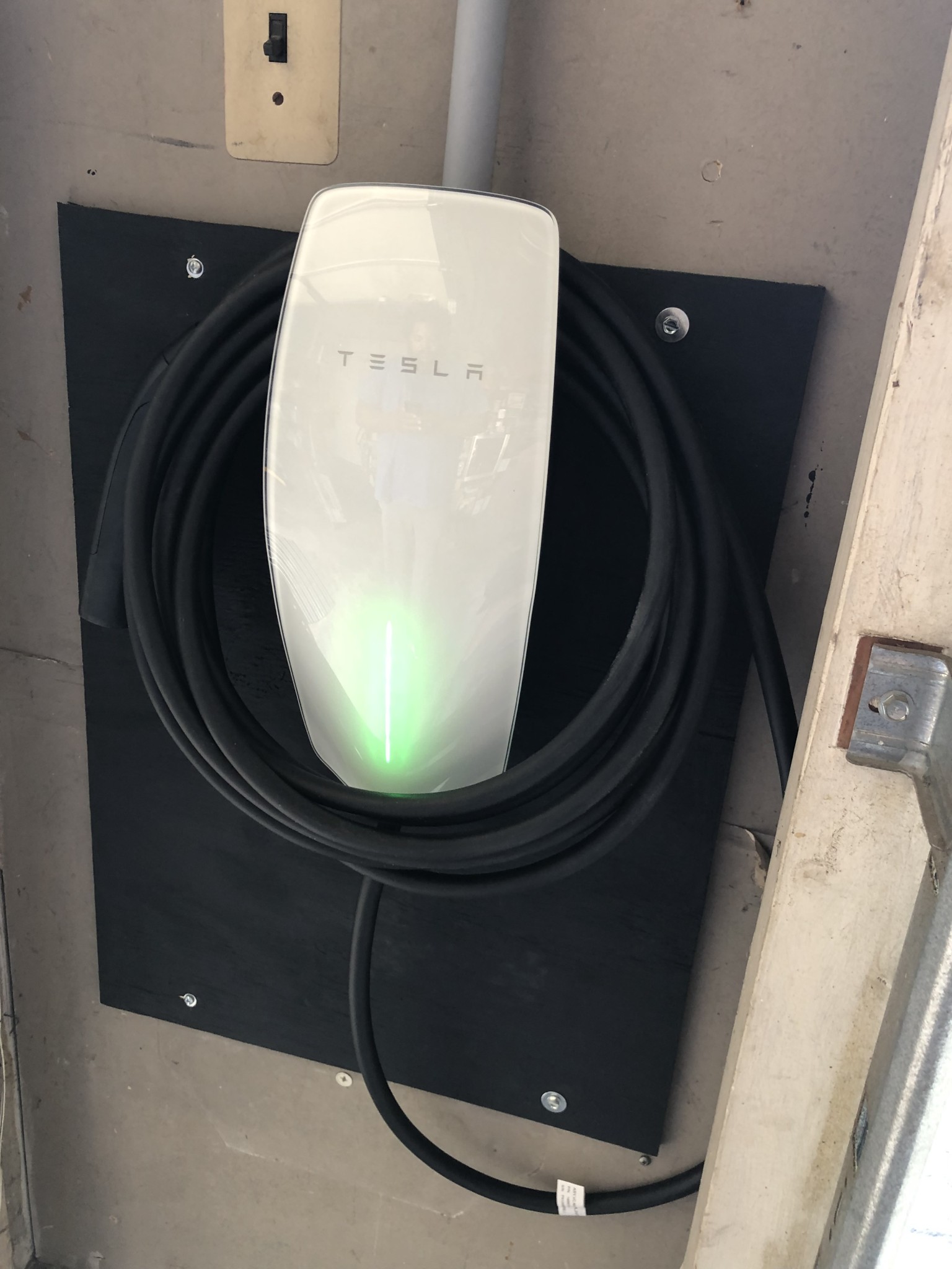 Tesla Charging station with a 60 amp 240 volt dedicated electrical circuits.