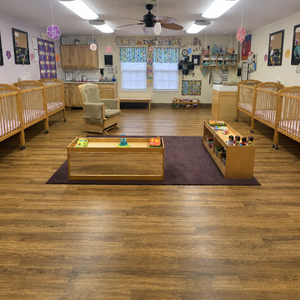 Bright and colorful preschool classroom at Childcare Network with age-appropriate learning materials