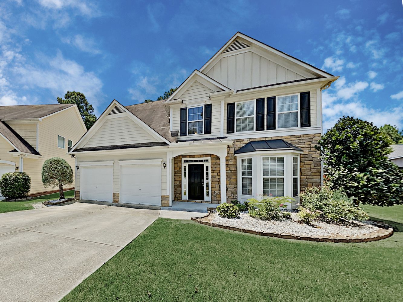 Gorgeous home with great landscaping and a two-car garage at Invitation Homes Atlanta.