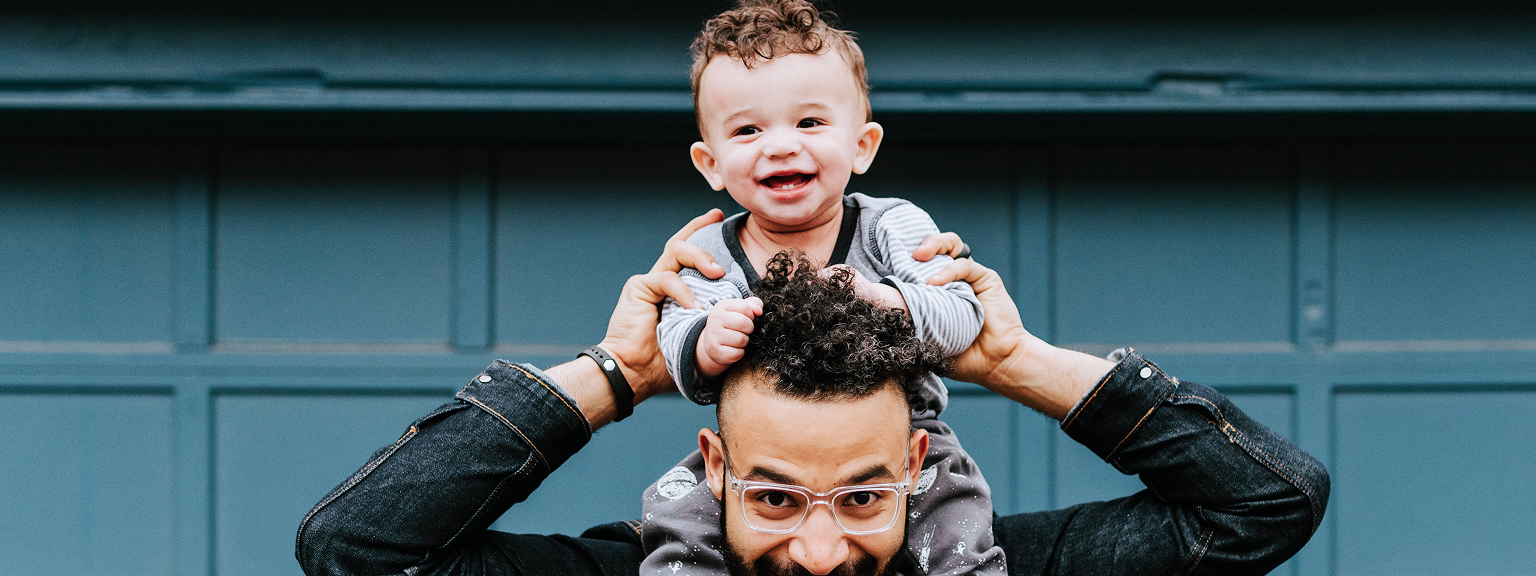 A father with his son on his shoulders.