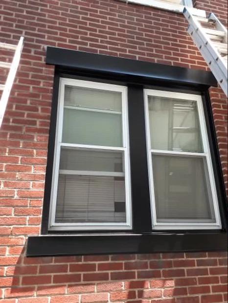 Our handyman project here in Salem, MA, was to wrap the windows in black aluminum.