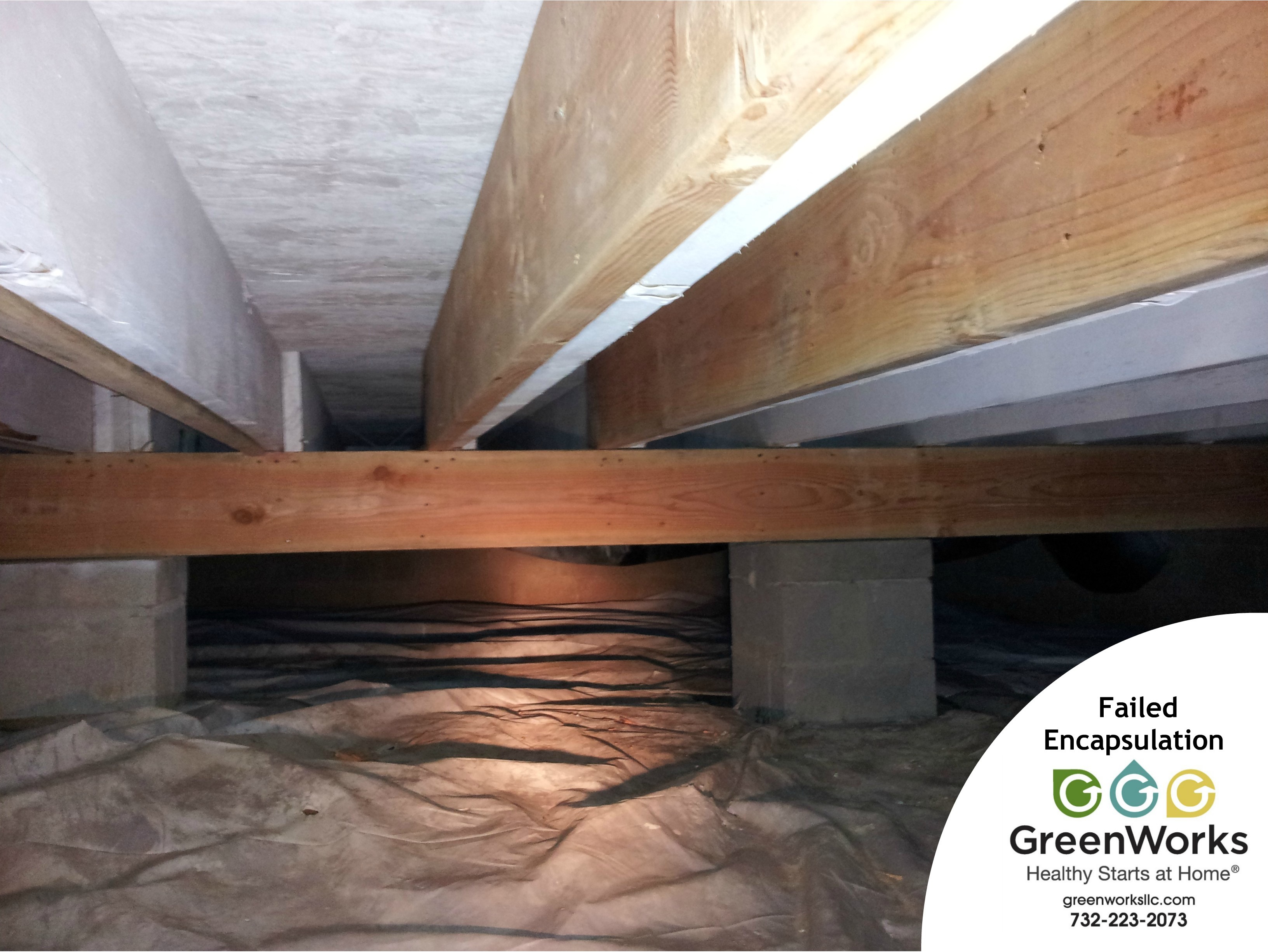 Crawl space inspection photo showing wood framing and vapor barrier conditions, highlighting the importance of proper sealing and moisture protection.