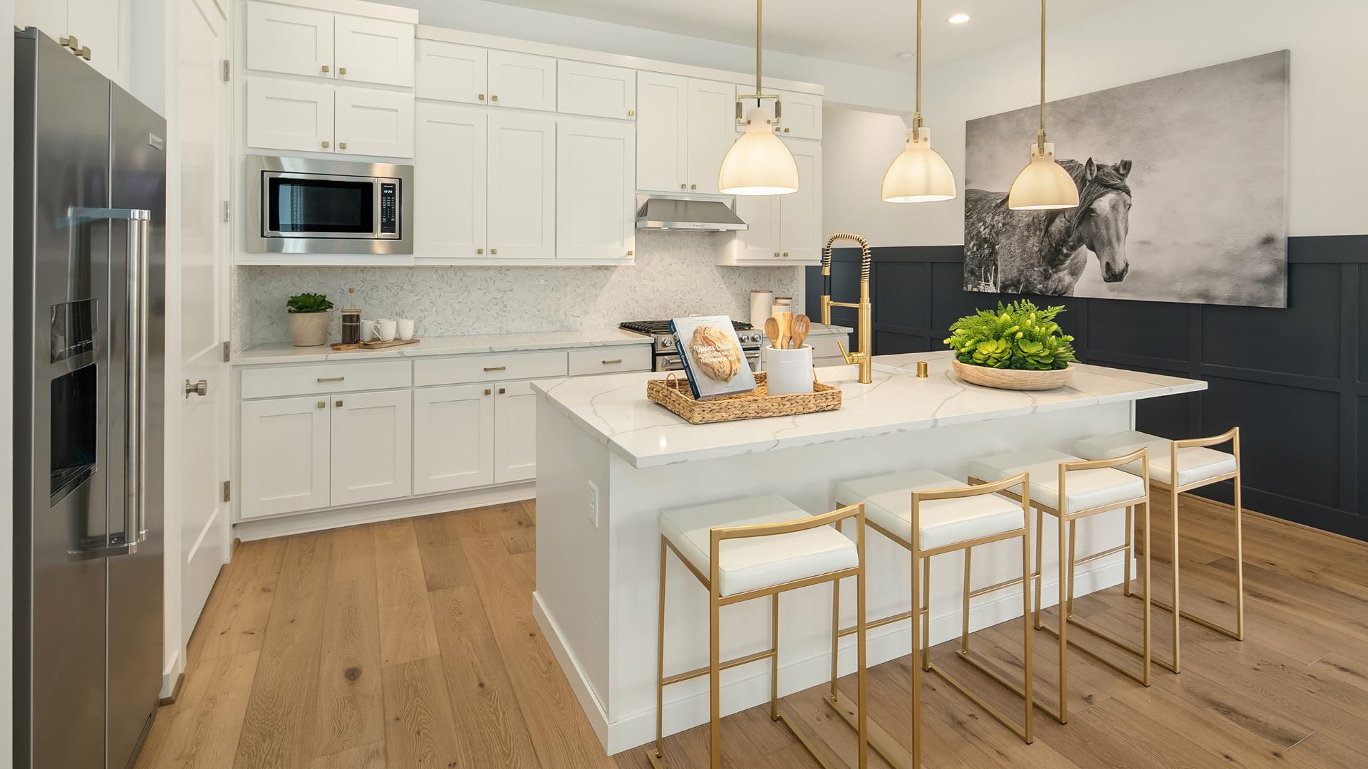 Well-designed kitchen features double-stacked cabinets for additional storage