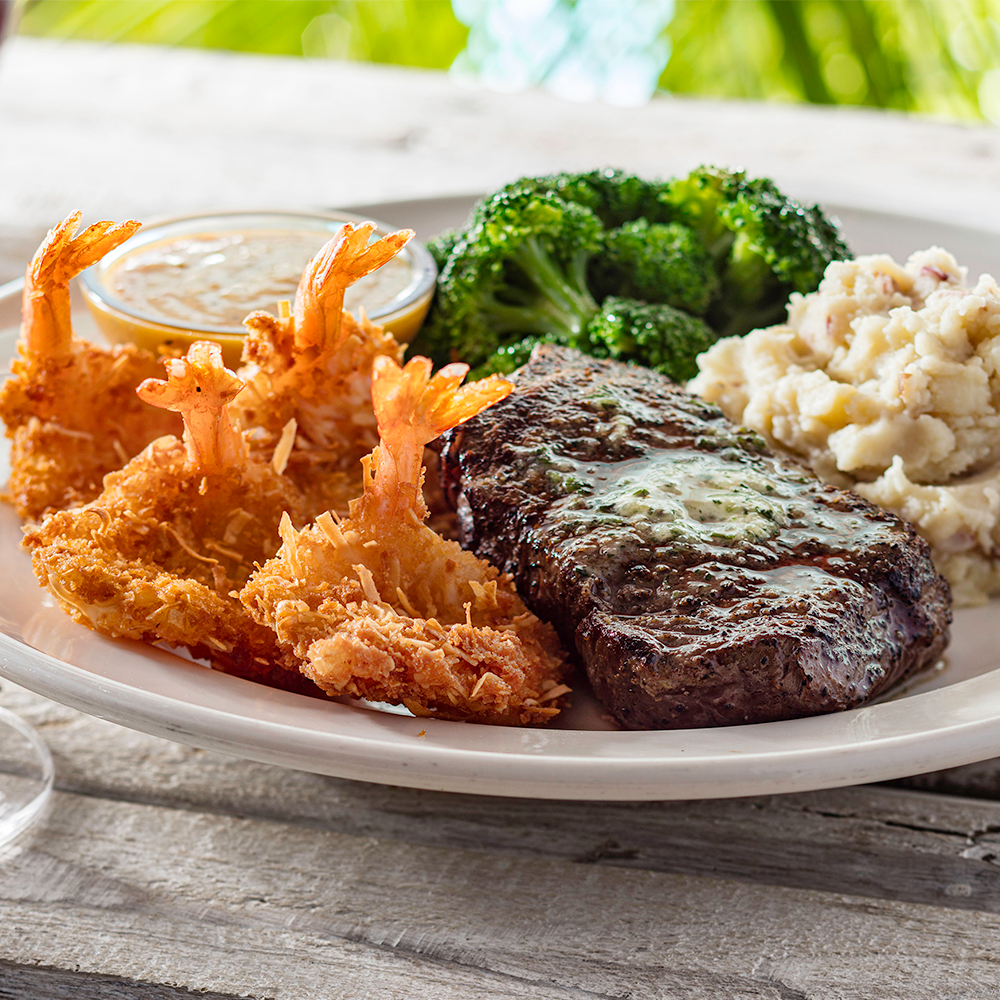 Top Sirloin & Coconut Shrimp - Our top sirloin paired with coconut shrimp, mashed potatoes and broccoli.