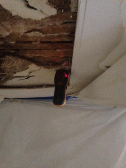 Checking moisture levels after a residential loss.
