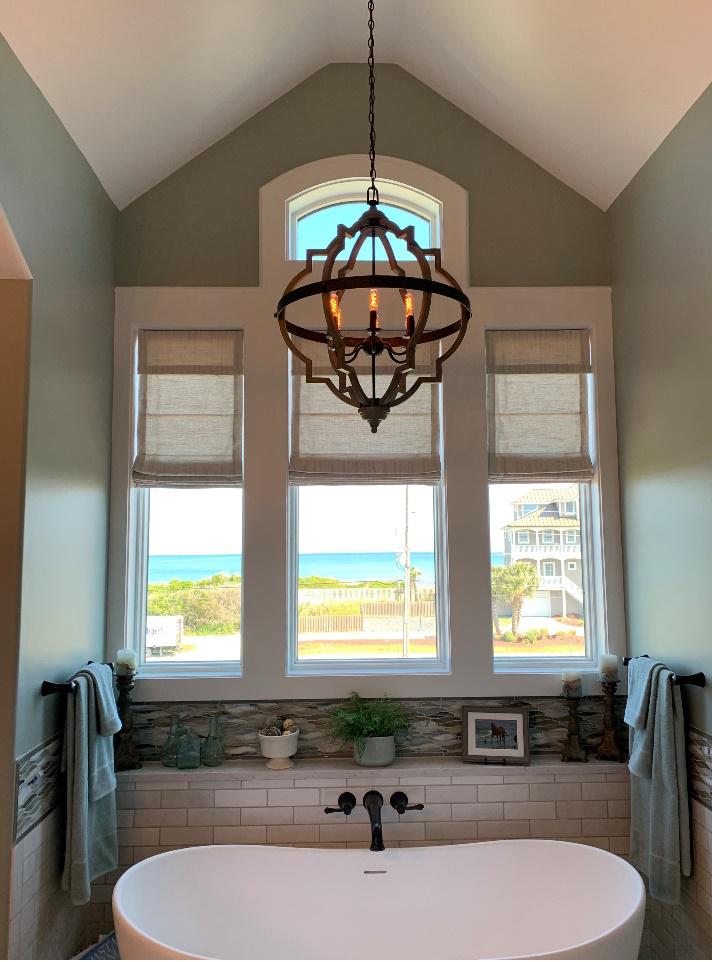 Glorify your bathroom to new heights of luxury with Vadain Roman Shades from Budget Blinds. Transform your Jacksonville home into a serene oasis where style meets functionality.