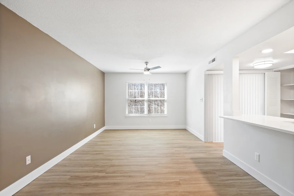 A room with a celling Fan