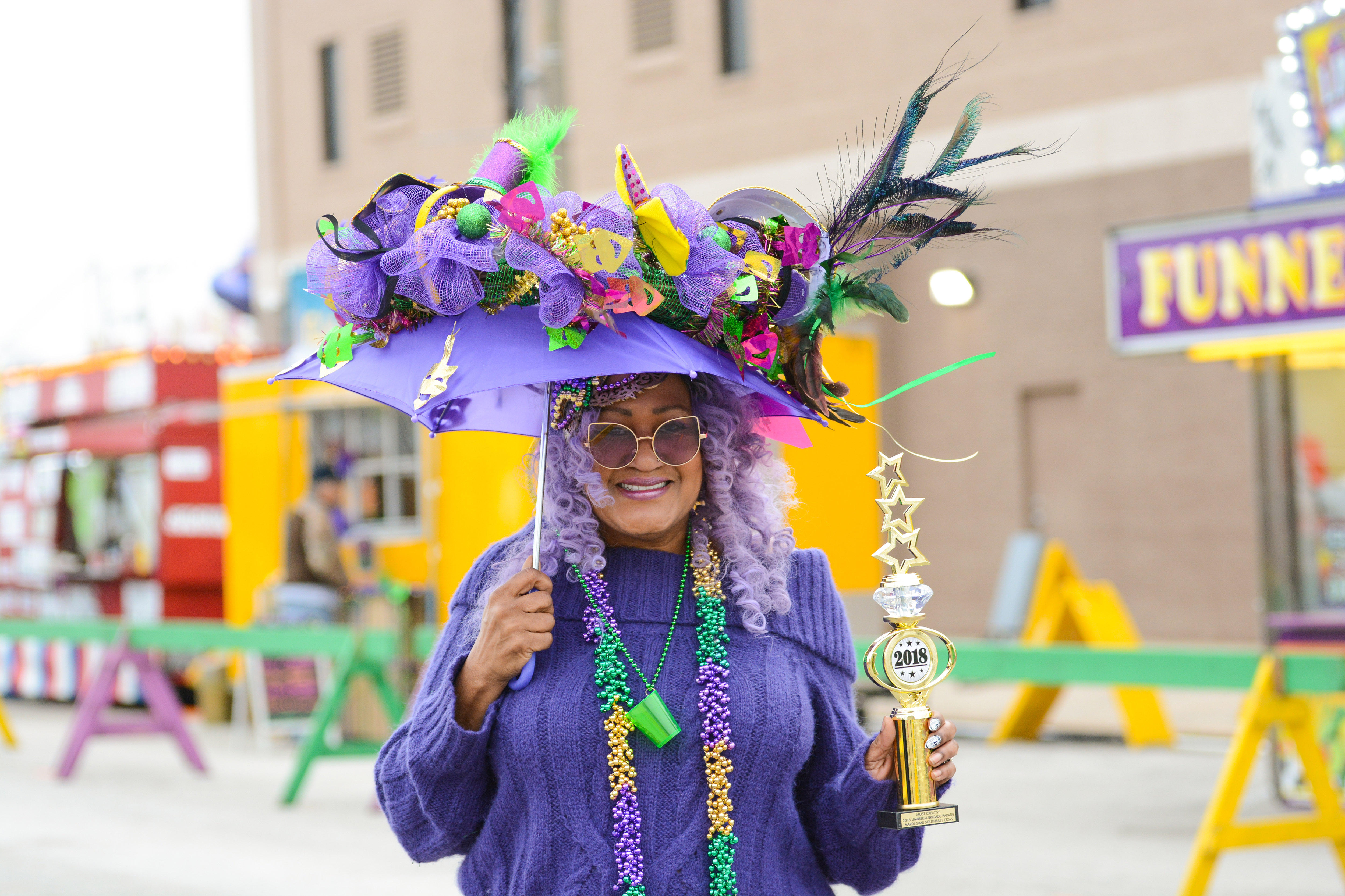 Woman dressed in purple Mardi Gras attire for Mardi Gras in Port Arthur, Texas