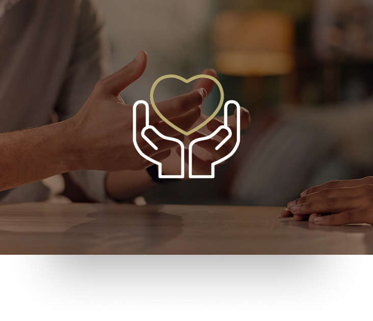 Hands gesturing across a table during a conversation.