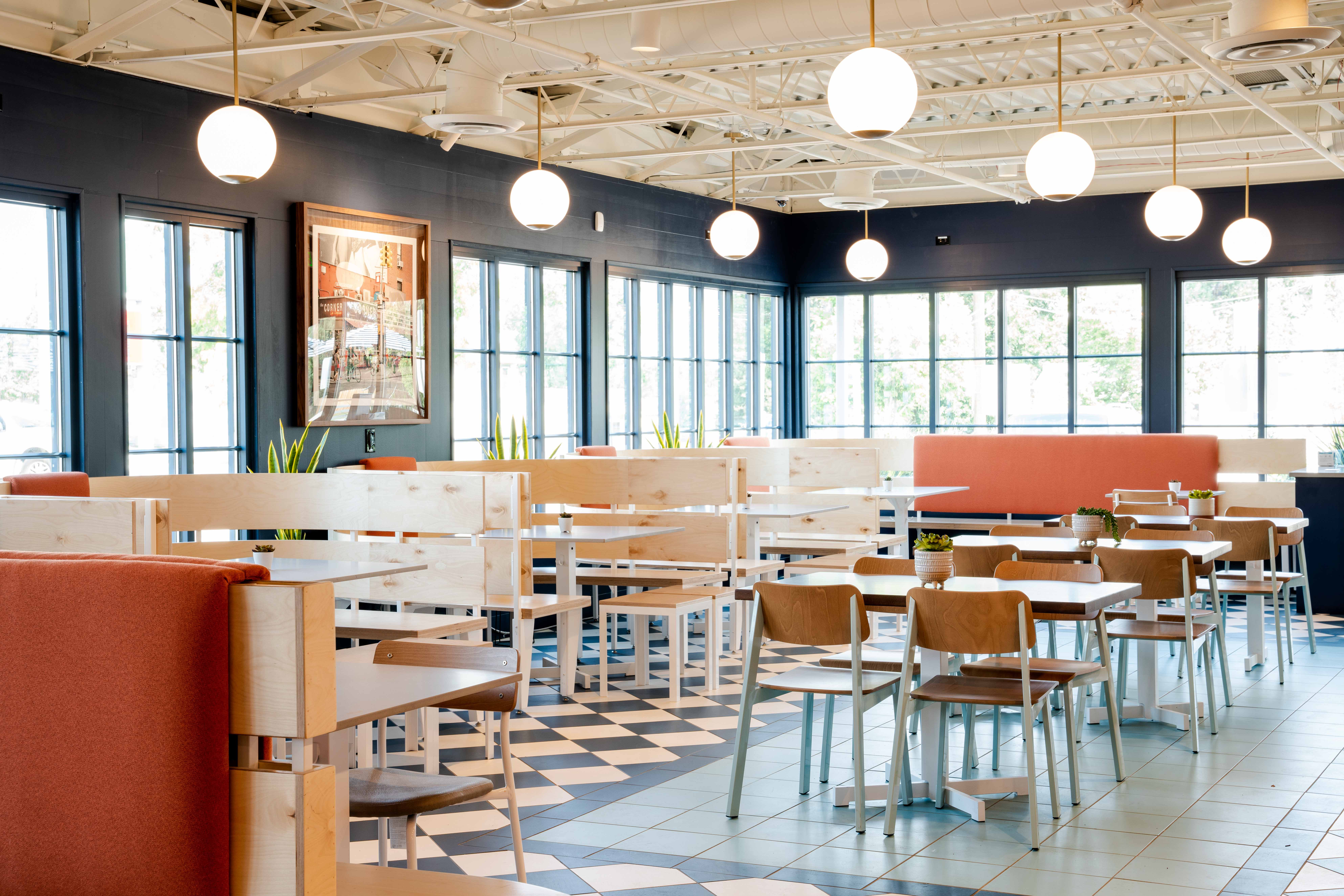 Interior of Birdcall Cherry Hills with vast seating options. Pick from a booth or a table.