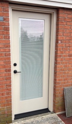 Rear entry door replacement for a residential deck by Highfield Door Sales in Dayton, Ohio
