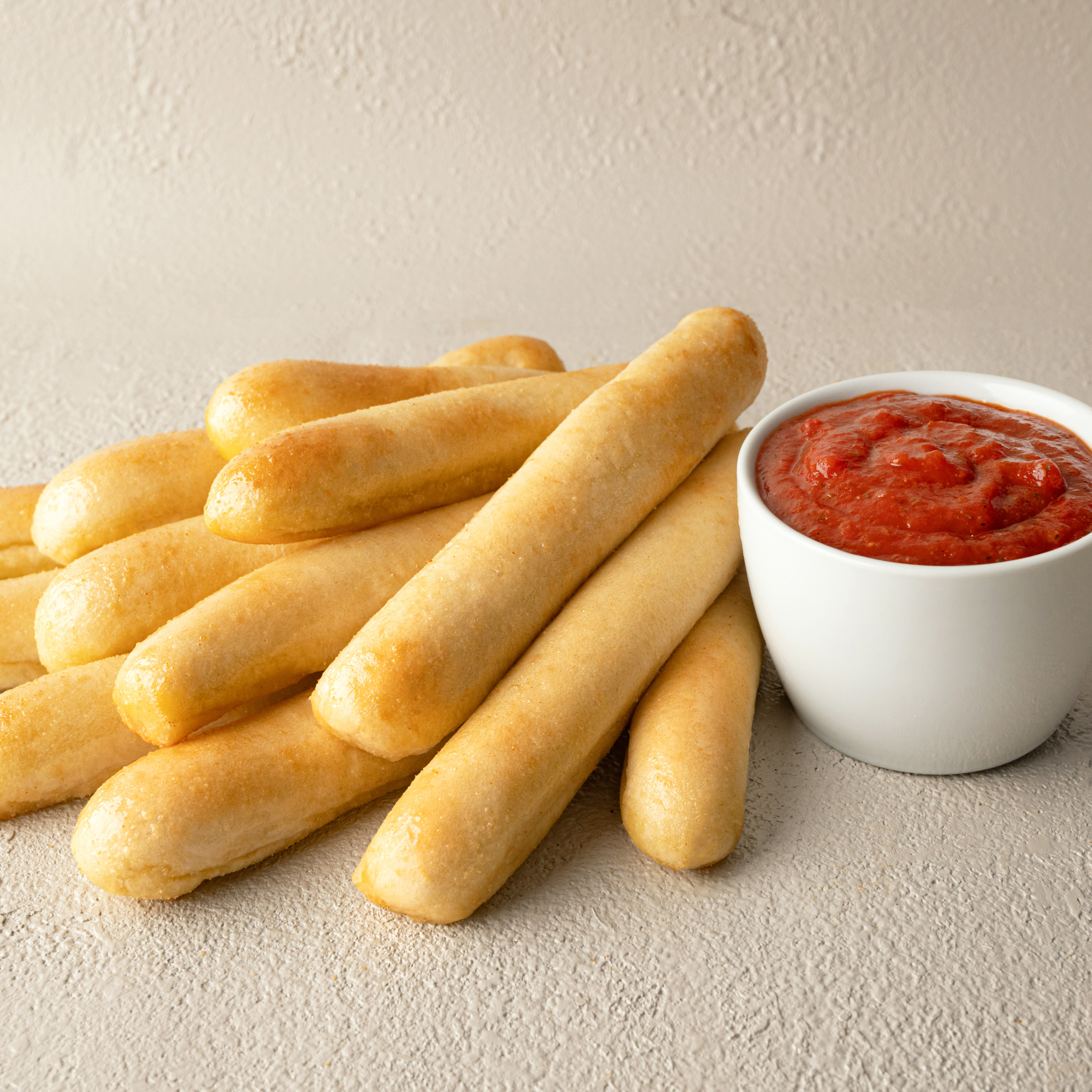 12 Signature Garlic Breadsticks with Large Dipping Sauce