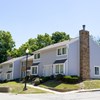 Two story townhome building with brick chimney