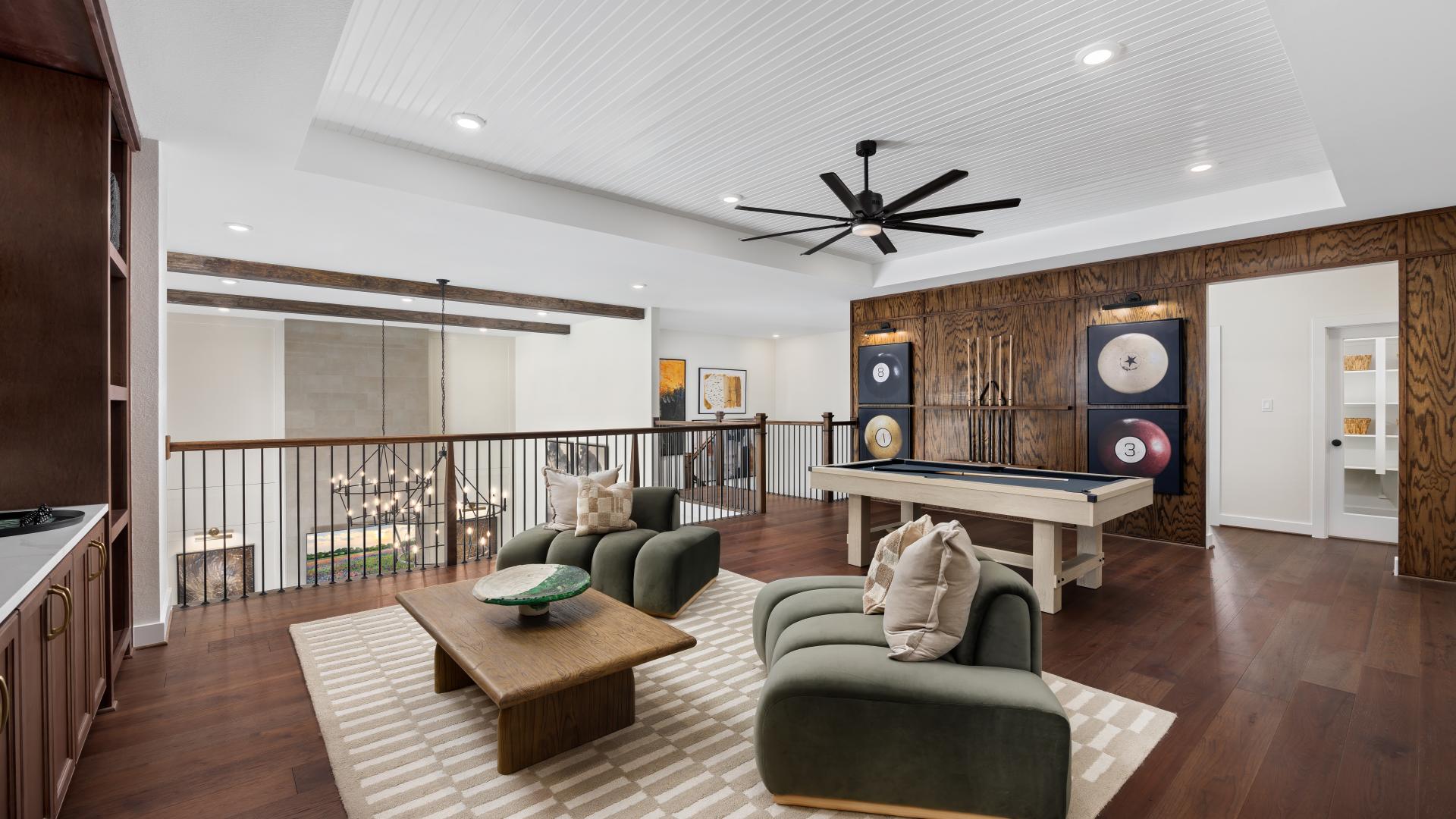 This flexible upstairs space easily adapts into a secondary lounge, homework zone, or casual reading nook