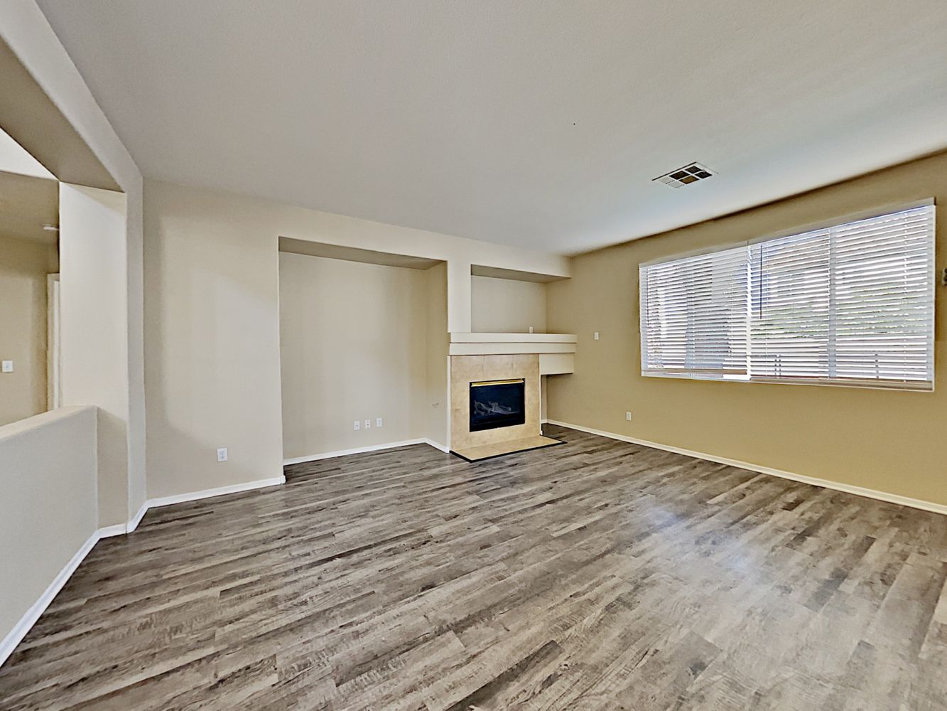 Spacious living room with fire place at Invitation Homes Las Vegas.