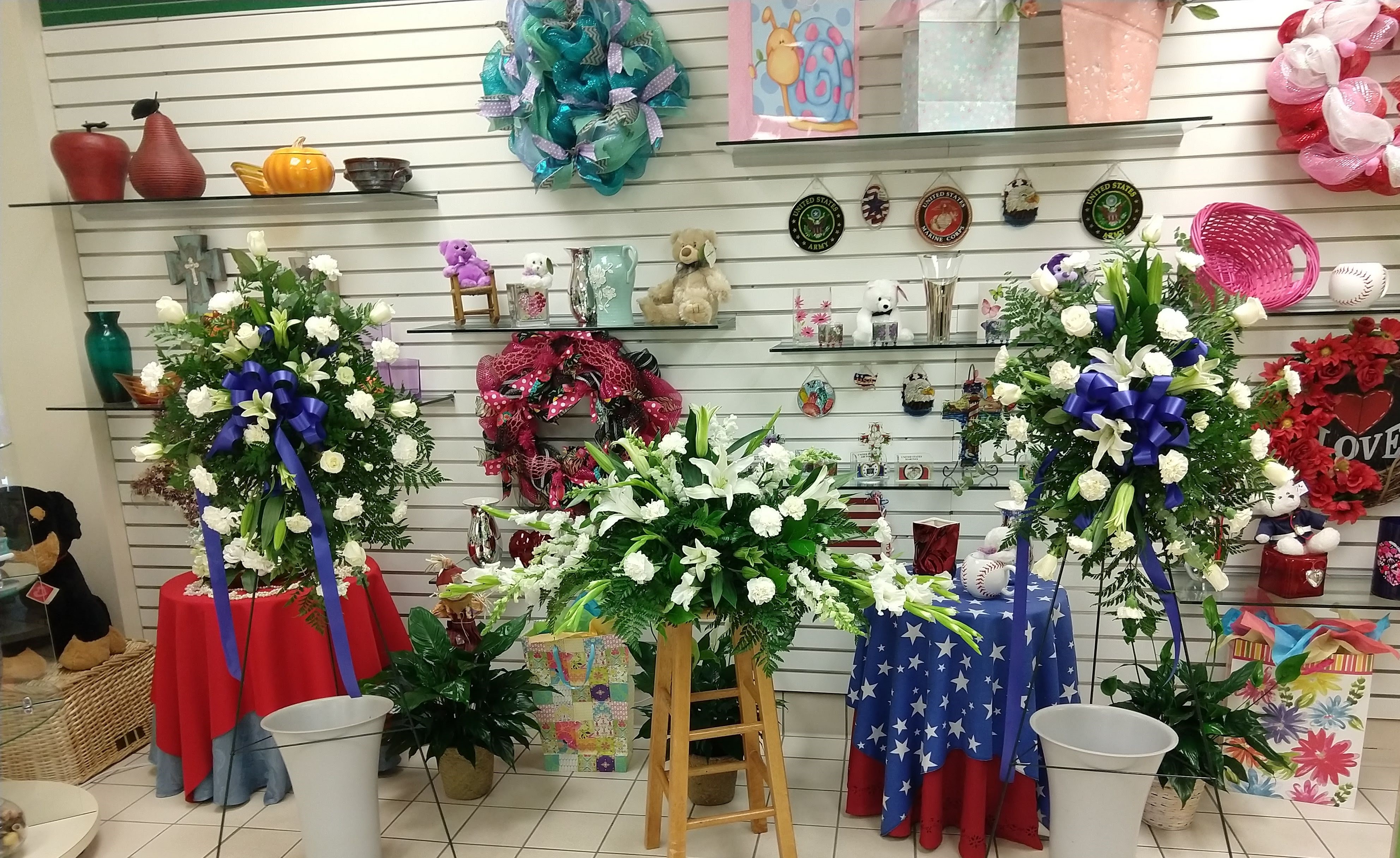 A full display of funeral arrangements are lined up in the Fort Bragg Flower Shop.