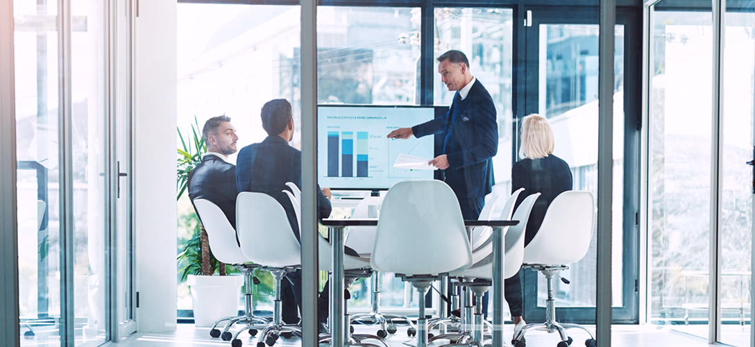 Financial professionals reviewing charts.