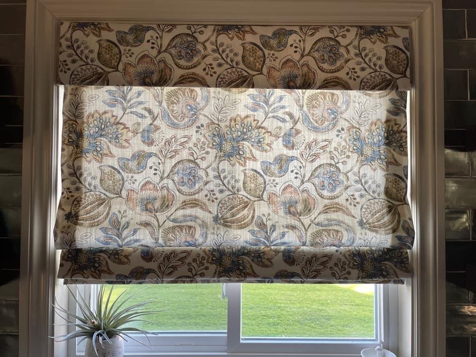 Printed fabric roman shades will add a statement to any room.