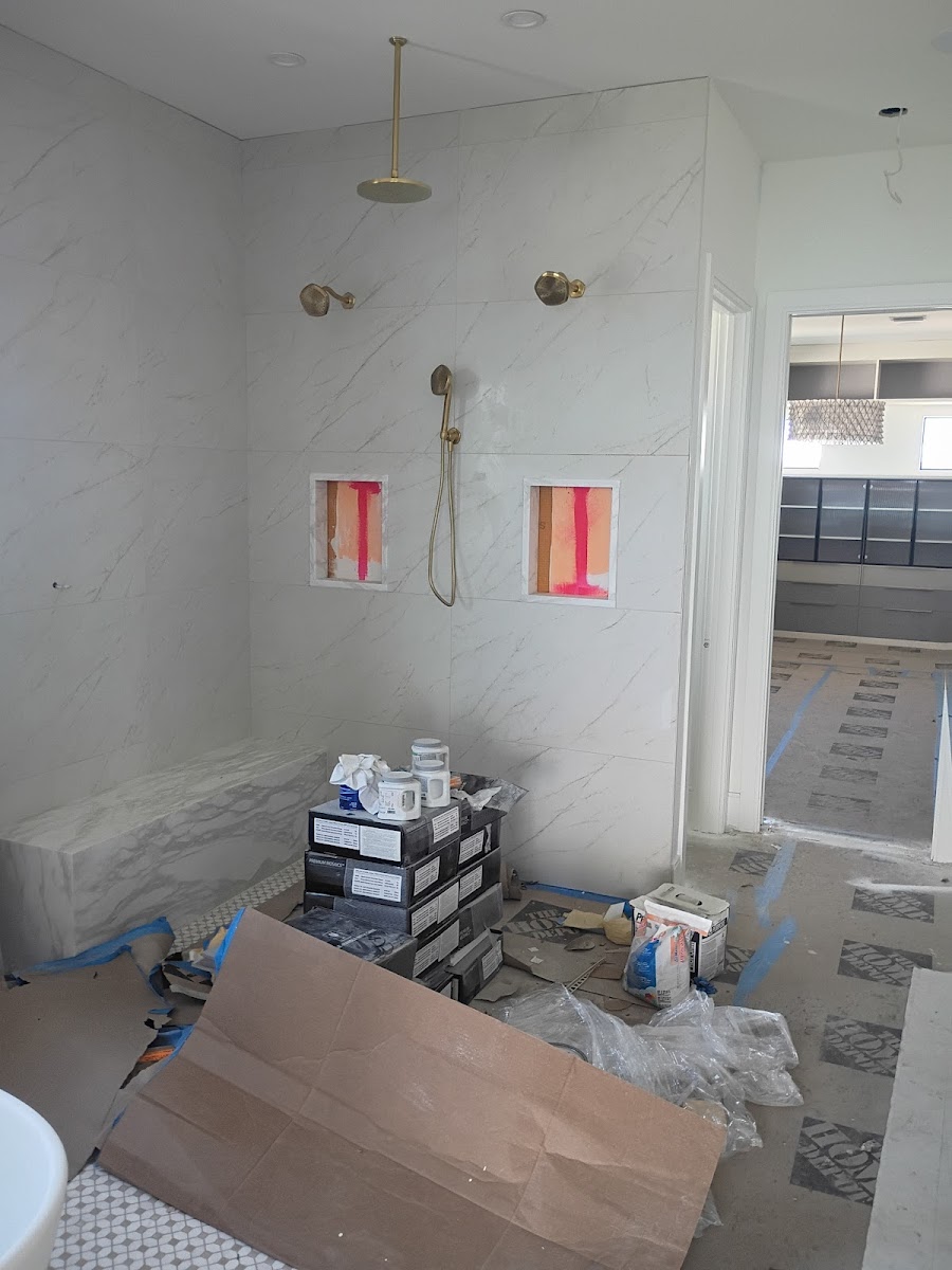 Laundry or utility room plumbing setup with exposed water lines, shutoff valves, and connections prepared for fixture installation.