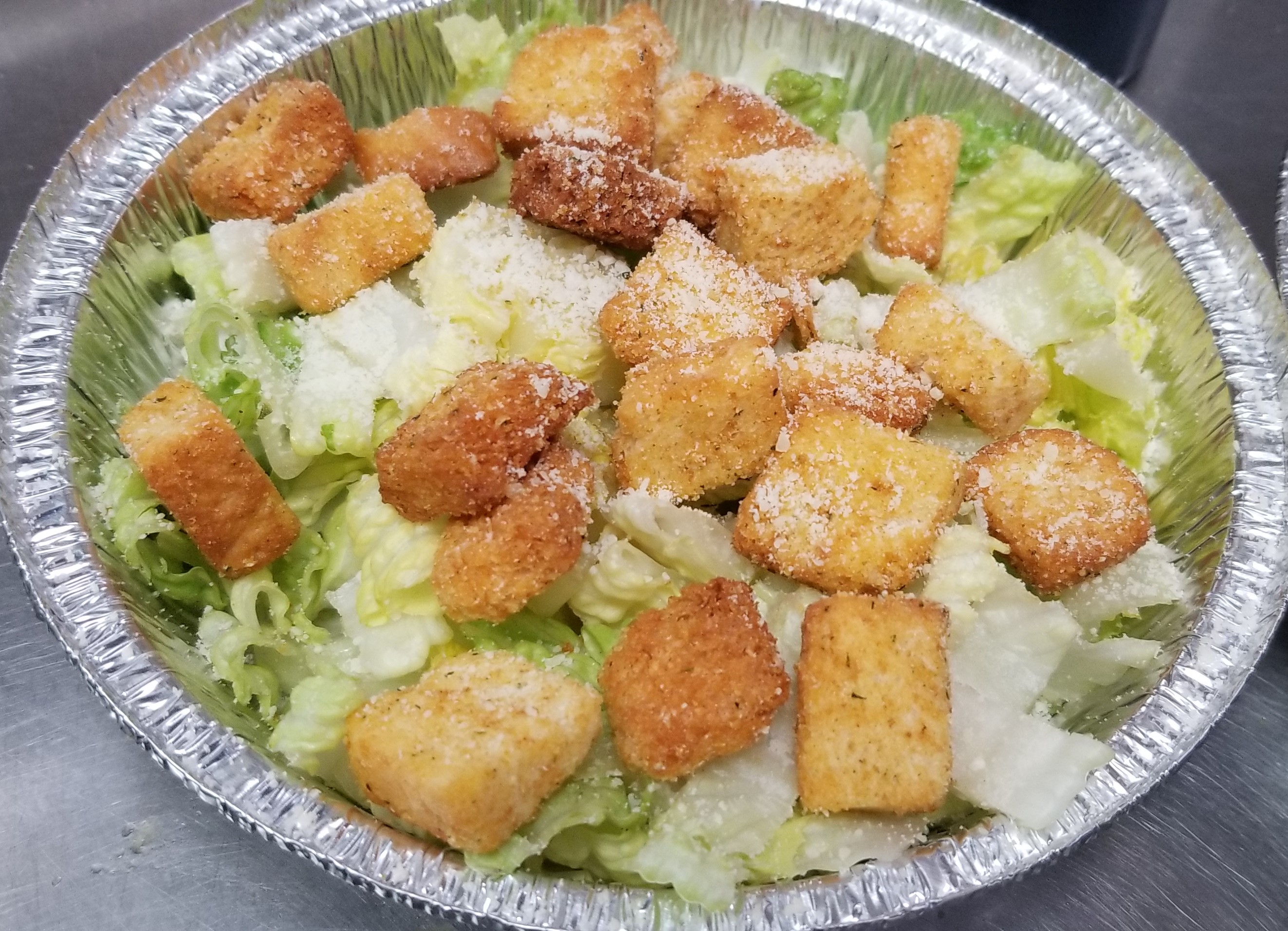 Traditional Caesar Salad! Served with dressing and bread stick!