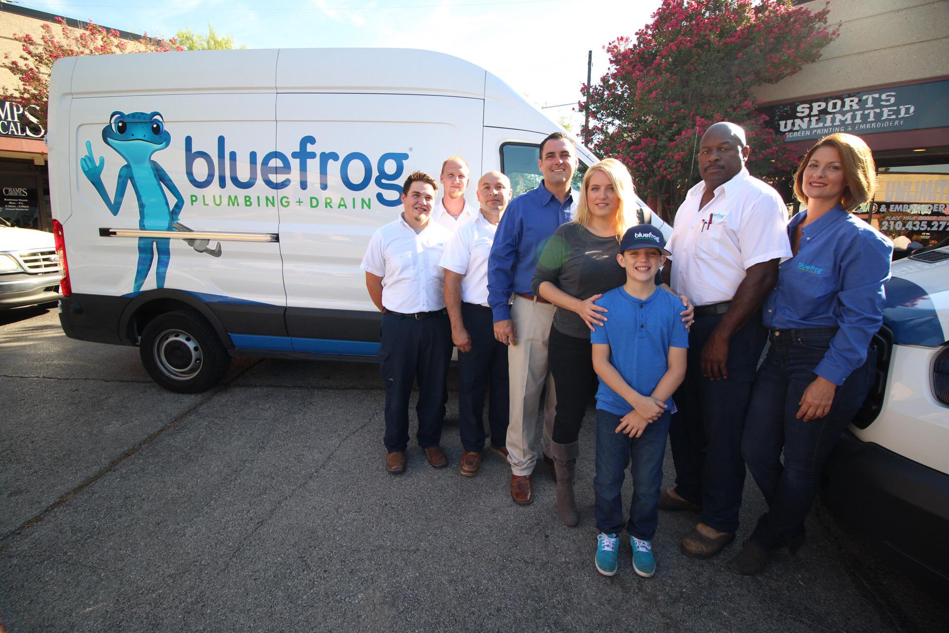 The bluefrog Plumbing + Drain of San Antonio in front of a plumbing service truck.