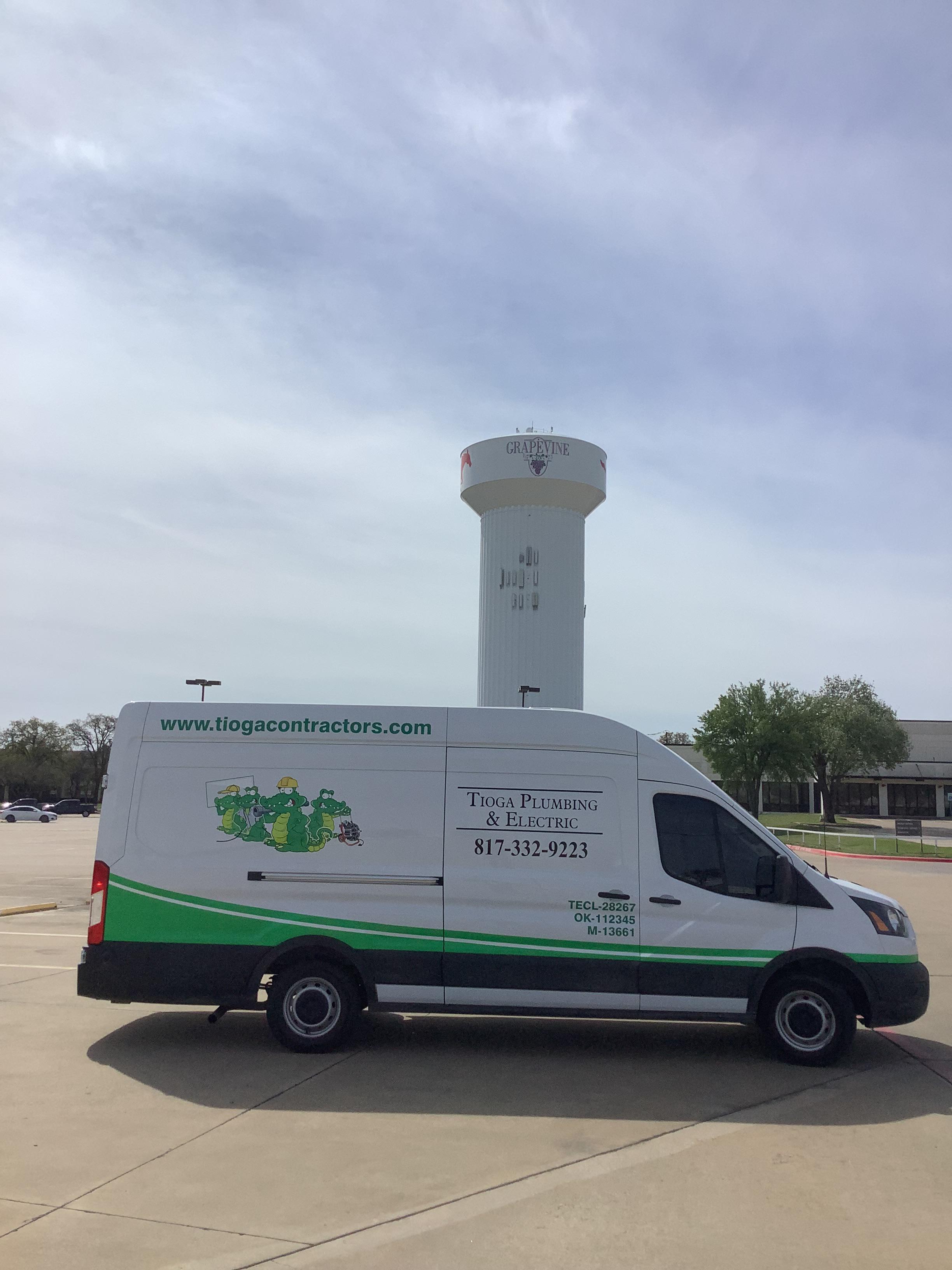 The Grapevine water tower and Tioga Plumbing & Drain service van in Grapevine Texas.