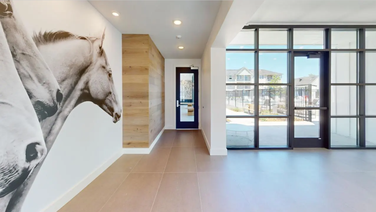 a horse mural on the wall of the spacious resident lounge