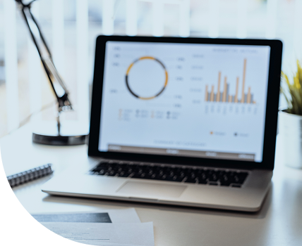 A laptop computer displaying financial charts.