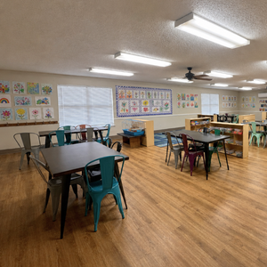 Bright and colorful preschool classroom at Childcare Network with age-appropriate learning materials