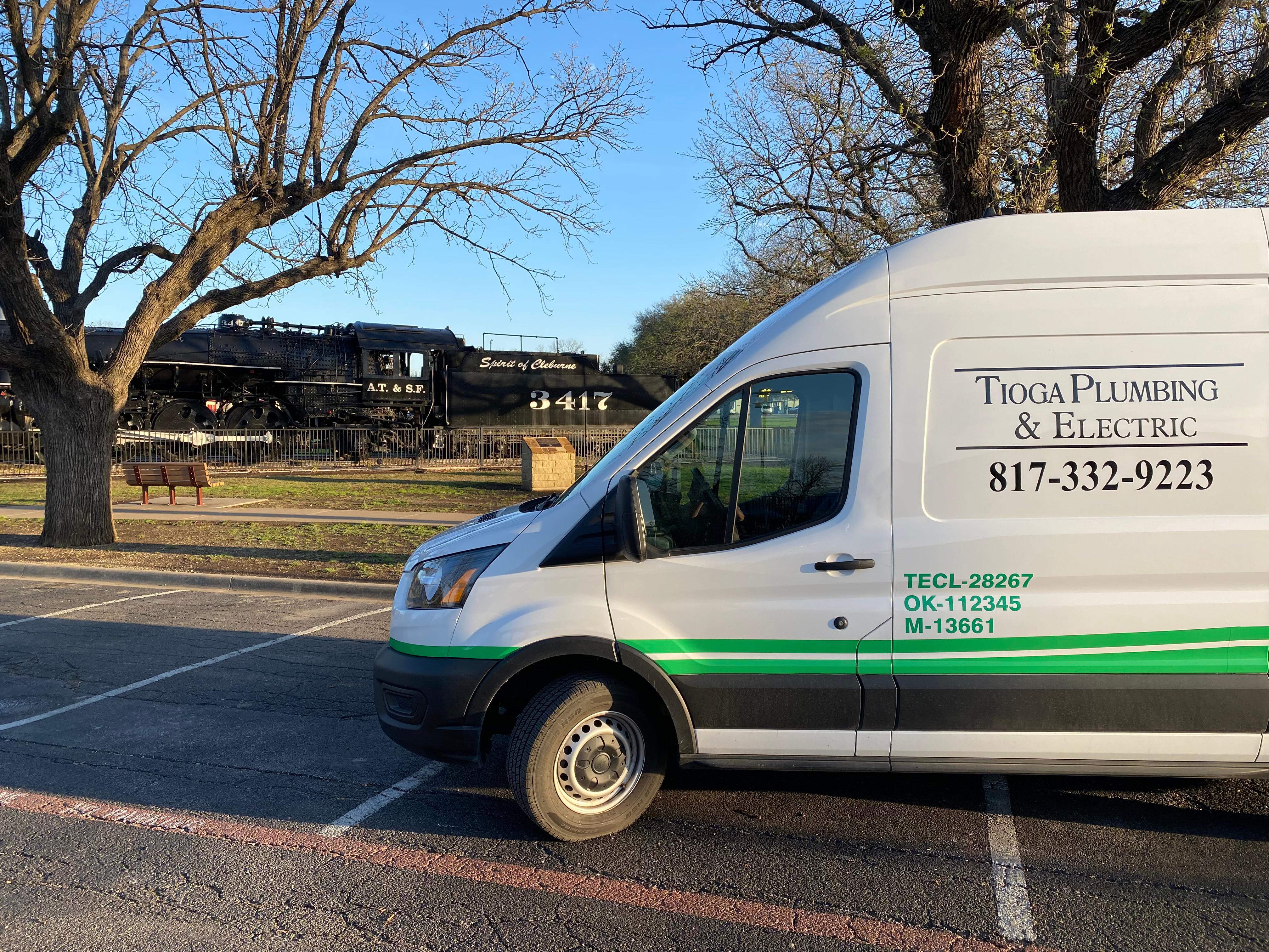 One of the Tioga Plumbing & Electric vans in front of the Spirit Of Cleburne train in Cleburne Texas.