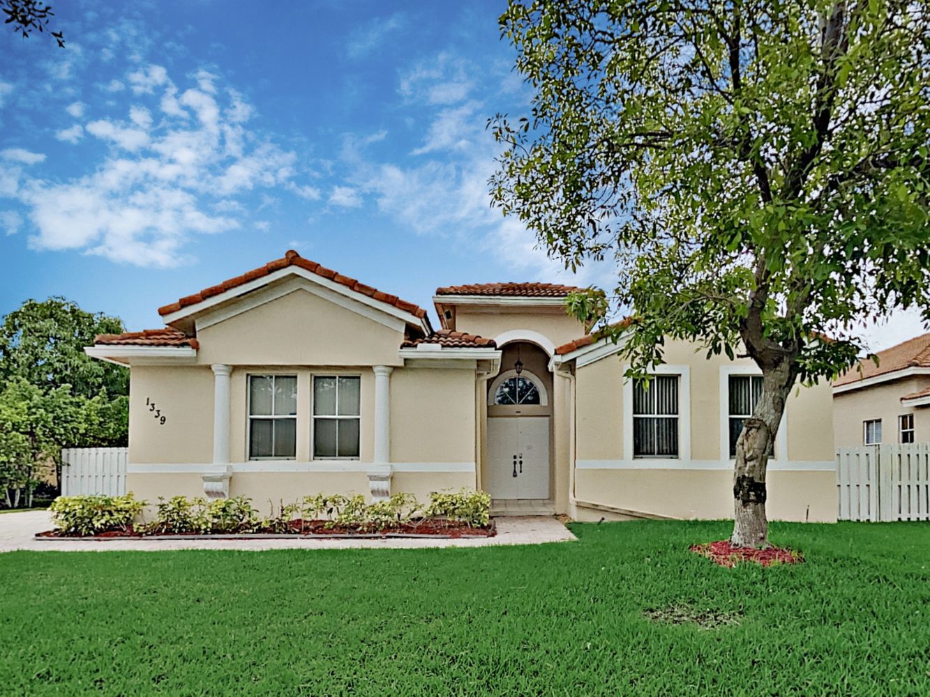 Beautiful Invitation Homes property with gorgeous landscaping in South Florida.