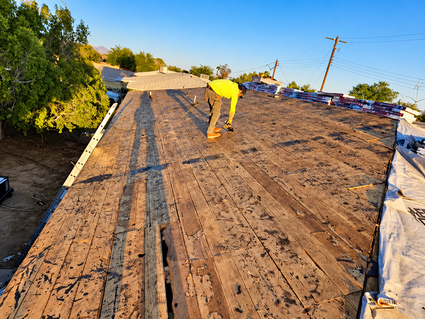xposed residential roof deck during a roof tear-off project by Apex AZ Roofing in Arizona, showing t 