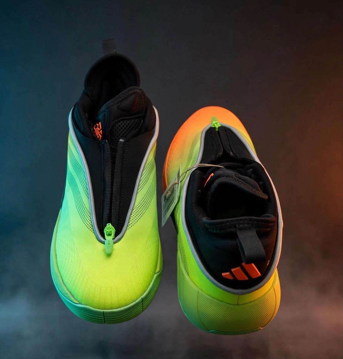 A pair of neon green and orange gradient athletic shoes with black zippers and reflective trim, presented against a dark, smoky background with atmospheric lighting.