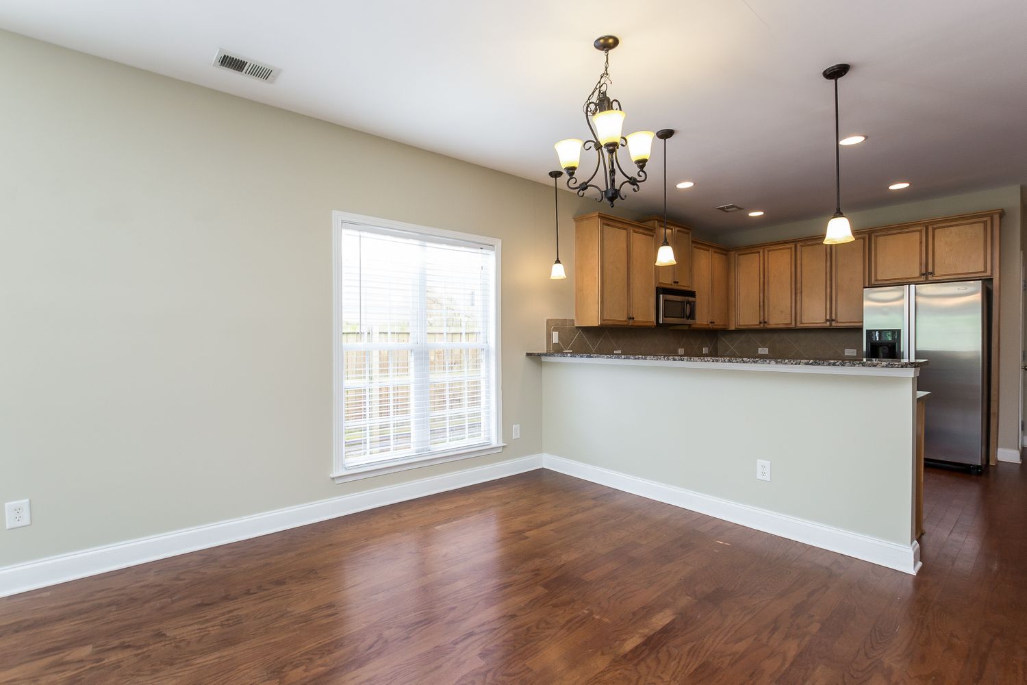 Breakfast nook with wood flooring at Invitation Homes Atlanta.