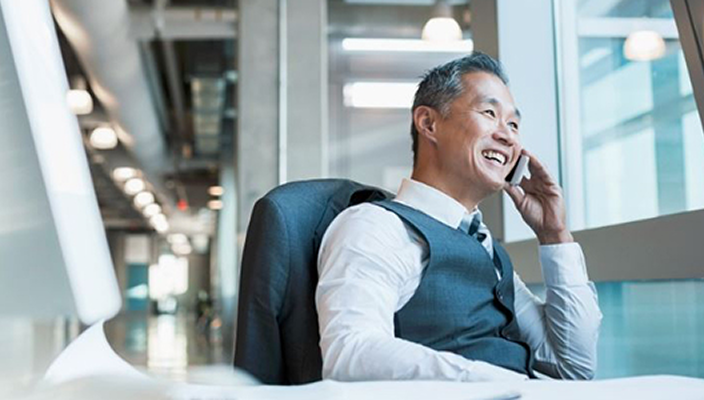A business owner taking a call on his cell phone.