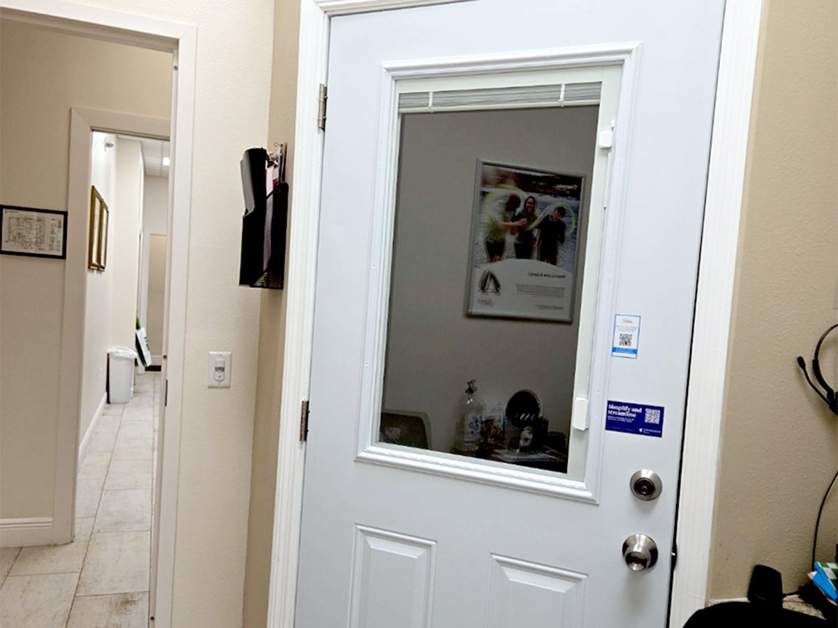 Interior photo of the hearing testing booth for AudioNova hearing clinic in Bushnell, FL