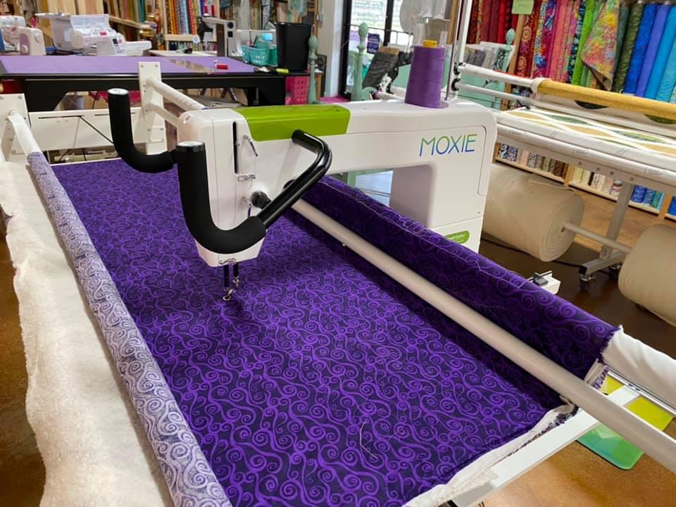 Don't just make those quilt tops and stop! Let us help you complete it with one of our beautiful edge-to-edge quilting designs. We have a large selection of wideback fabrics for your convenience as well as batting which we sell by the inch. Binding problems? We can do it for you OR teach you how. All of our longarm quilting is done in-house on our Handy Quilter Infinity longarm machine with the Pro Stitcher. The Pro Stitcher offers state-of-the-art stitch and design precision. We have a large selection of quilting patterns and designs, and we are always adding new designs to our collection. We also offer Basting Services for those of you who enjoy hand quilting and machine quilting your quilt on your own domestic machine. We care for your quilt as if it were our own, and we love to put the final touches on your already beautiful quilt.