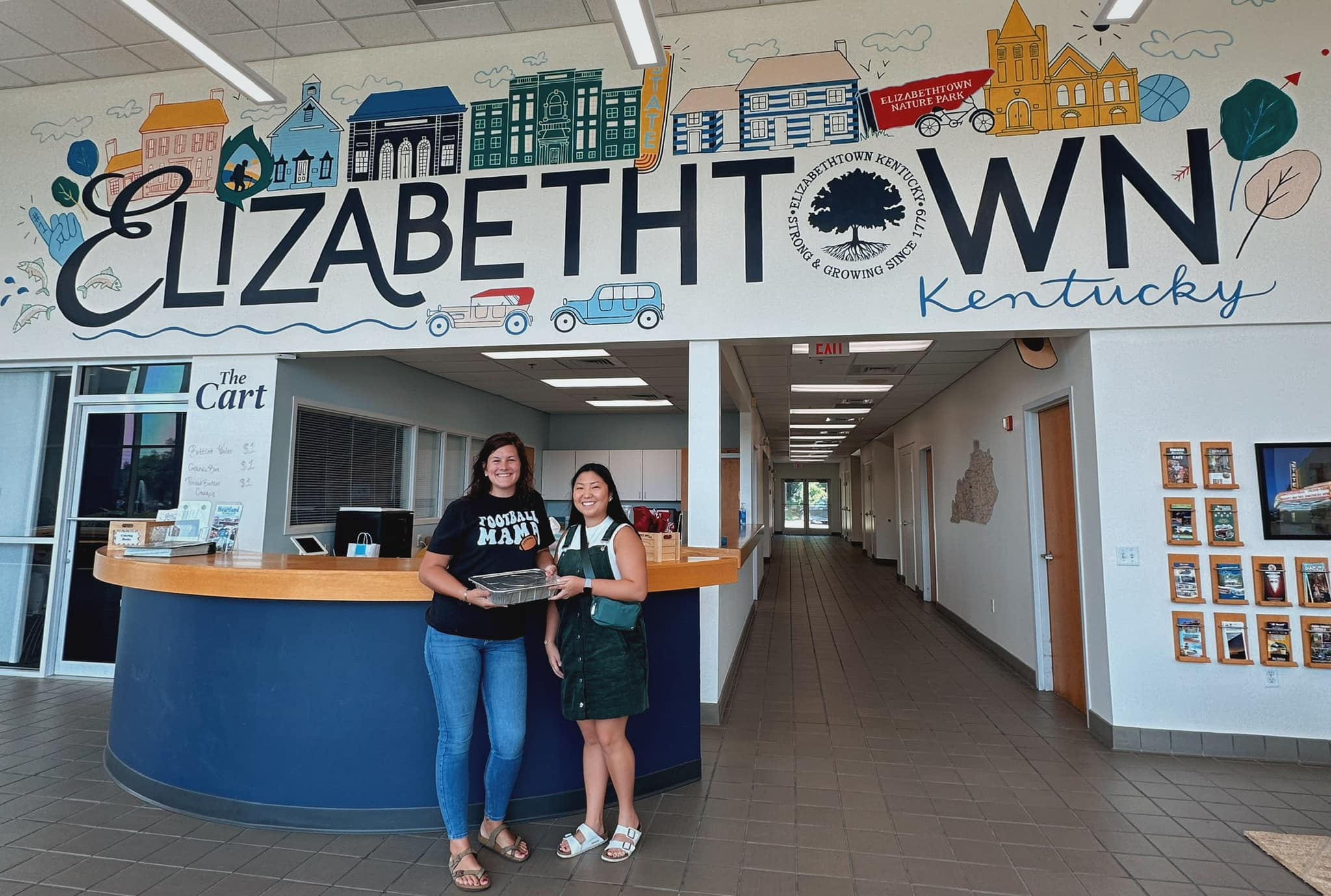 Keisha and Leanda in front of the beautiful mural at Elizabethtown Tourism!