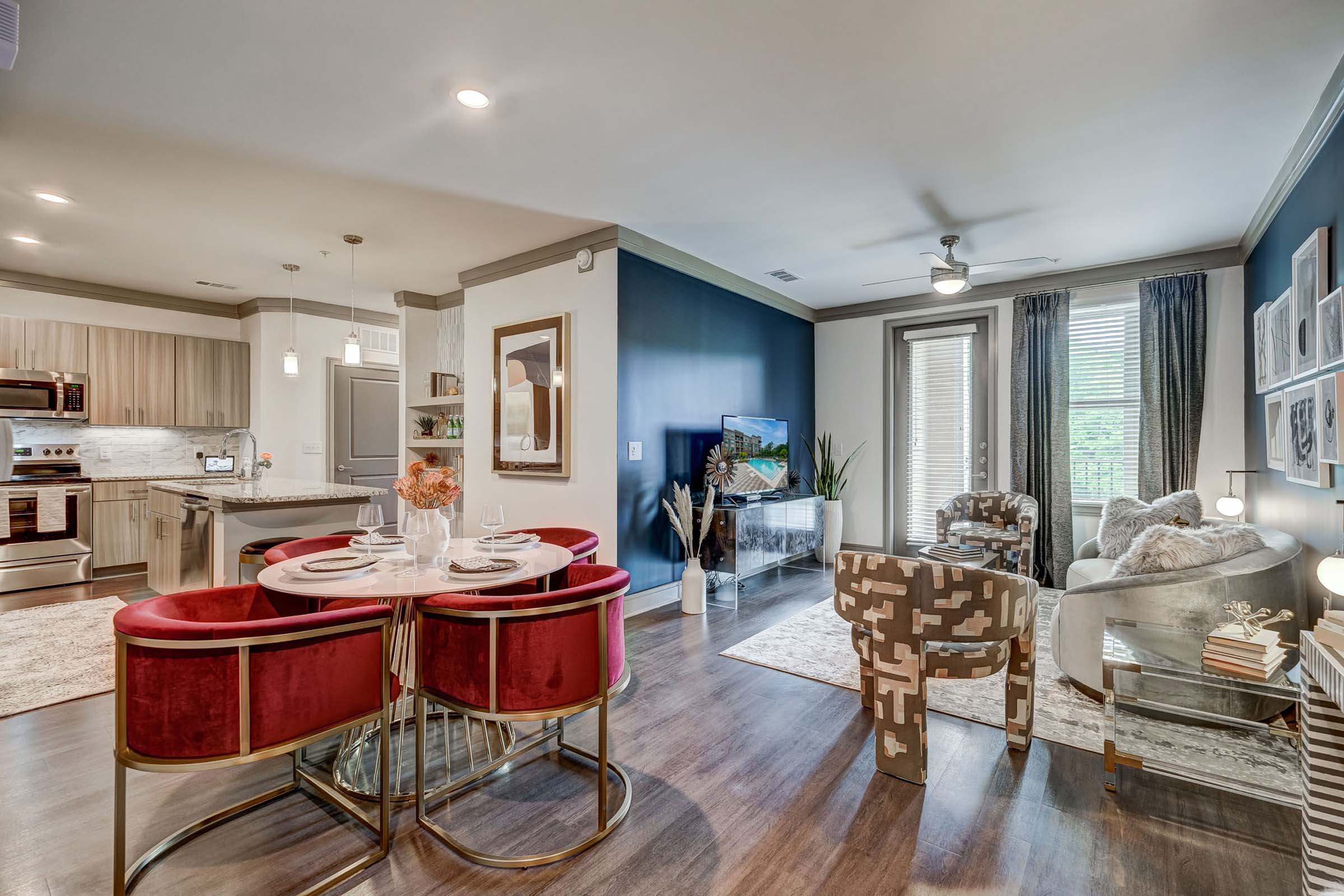 Kitchen, dining and living areas at Camden Alpharetta apartments in Alpharetta, GA.