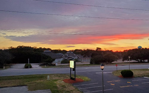 Beautiful Outer Banks Sunset Outside the Dare Capital Management Office in Nags Head, North Carolina.