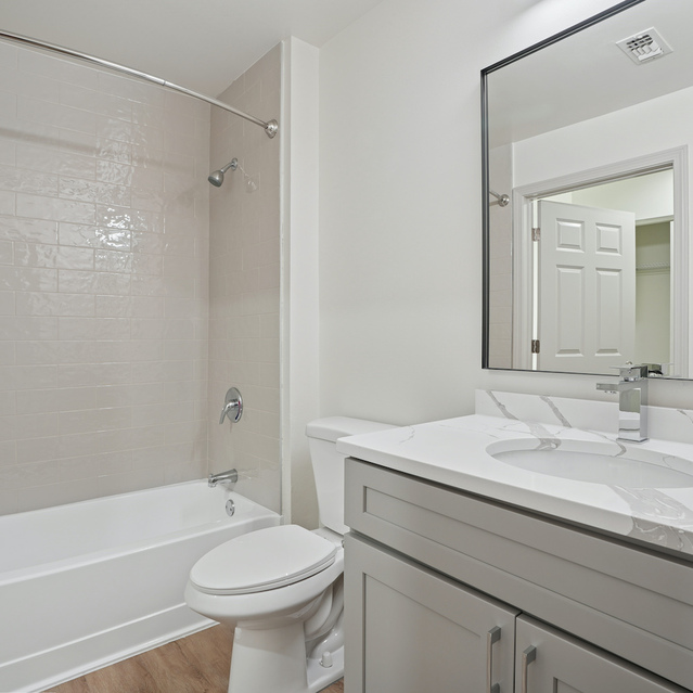 The Estates - Modern-Style Bathroom with Vanity and Tub