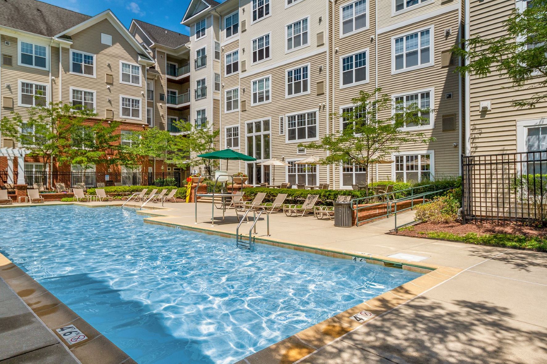 Sparking pool and lush landscaping to escape to after work