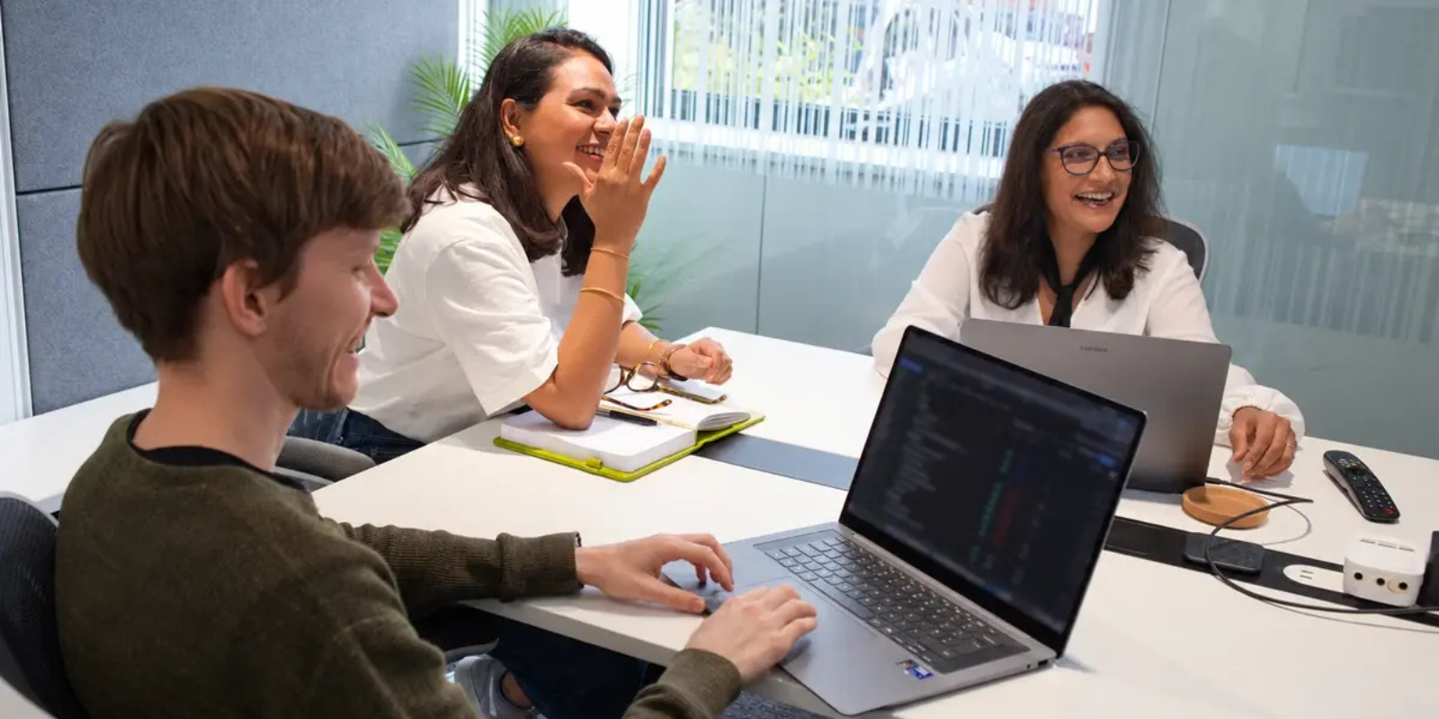 Priya, Lyndon and Natasha in a meeting in our conference room