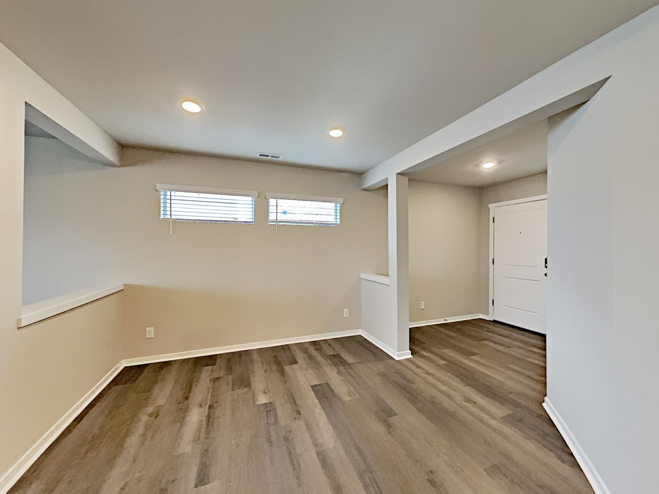 Foyer area with luxury vinyl plank flooring at Invitation Home Seattle.