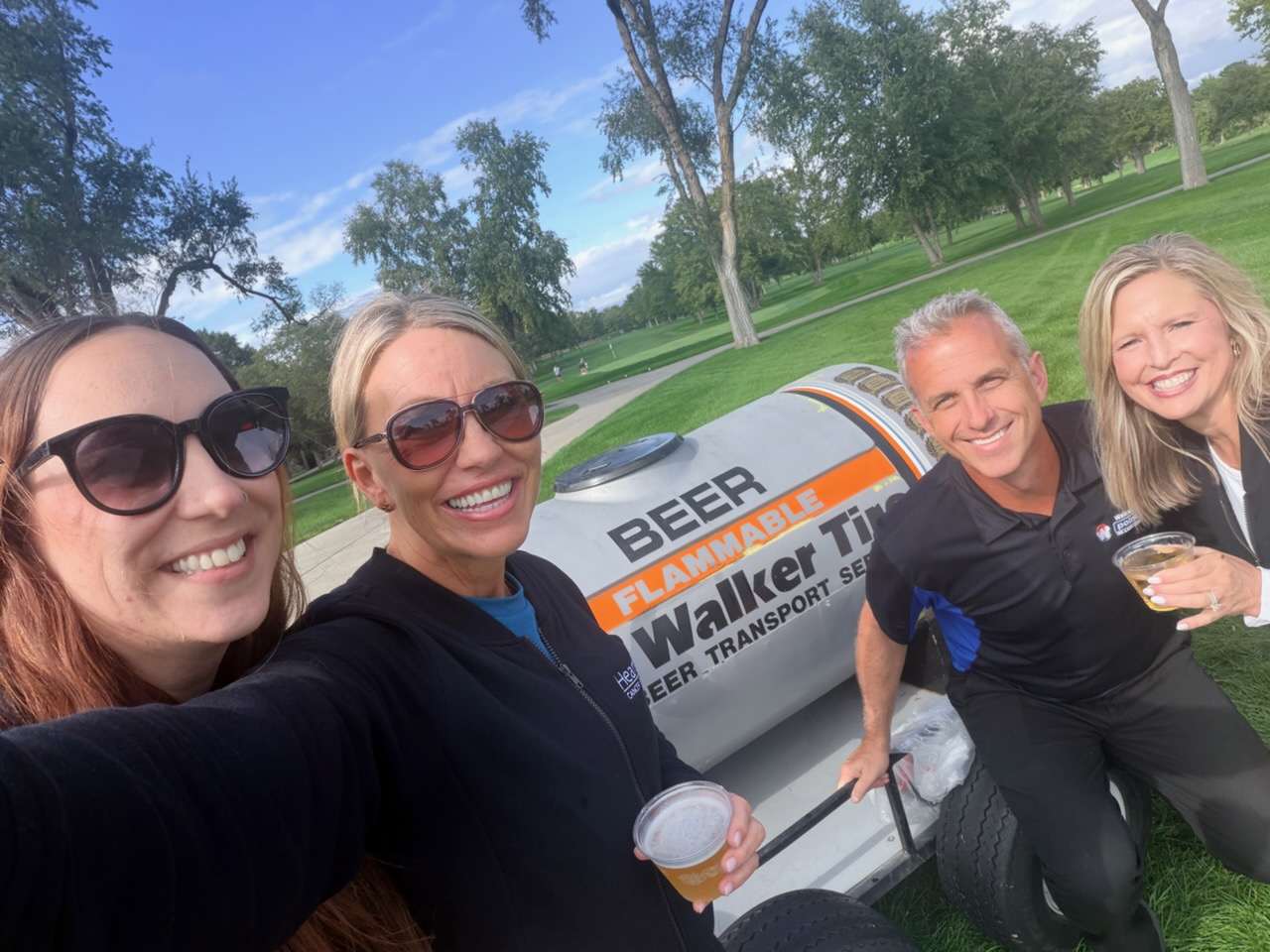 Walker Tire Point S and Heartland Cancer team members enjoying a local community event in Lincoln, Nebraska.