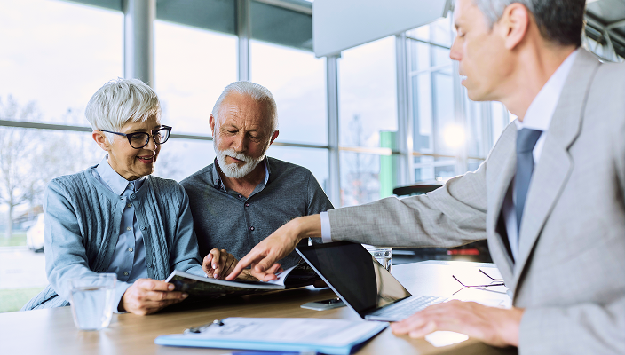 A portfolio manager assisting his clients.