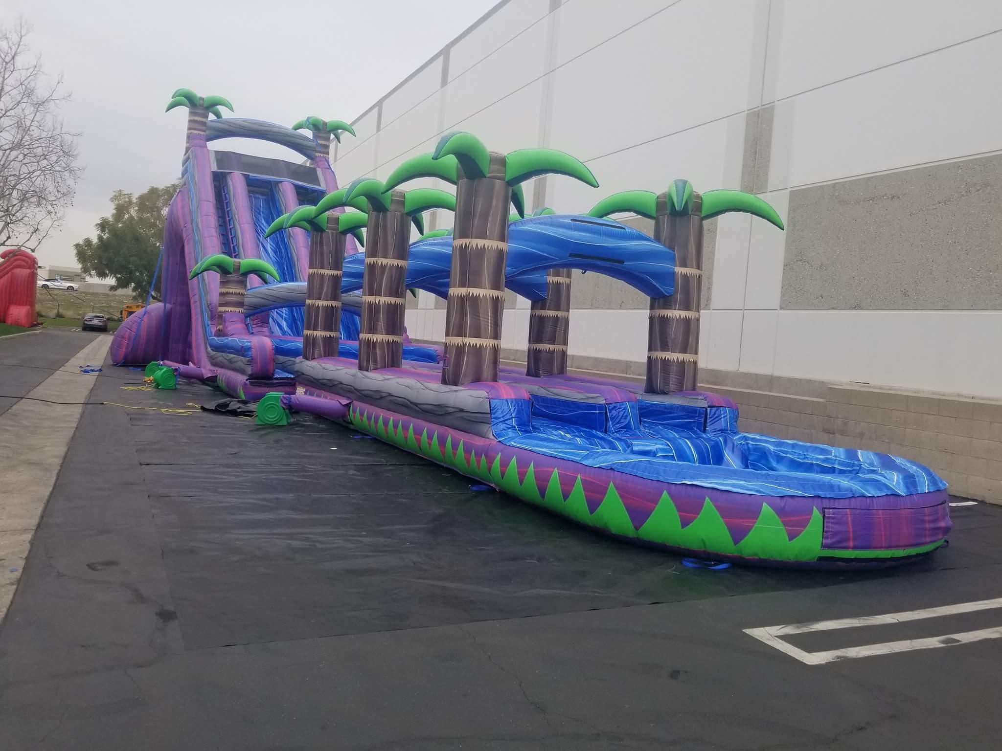 Purple water slide rentals at Jump And Slide Entertainment.Long Islands largest selection of inflatable party rentals along with may carnival party rentals...We offer Tents,tables chairs,food concessions mechanical bull rentals and so much more.
