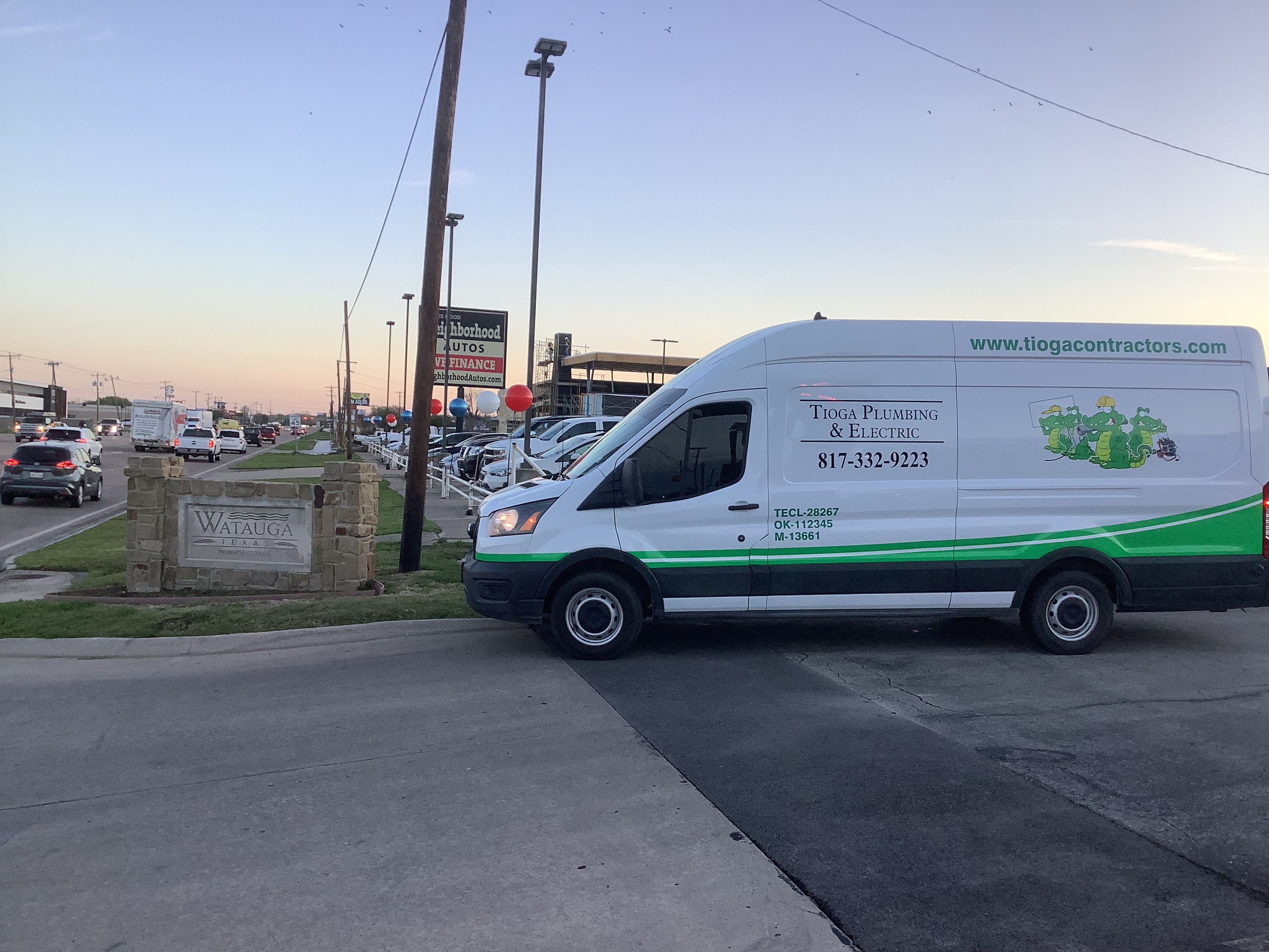 A Tioga Plumbing & Electric service van in Watauga Texas near Neighborhood Autos.