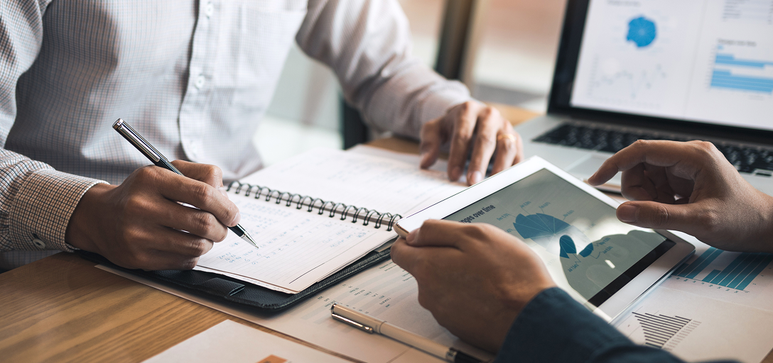 An investment advisor working with a client.