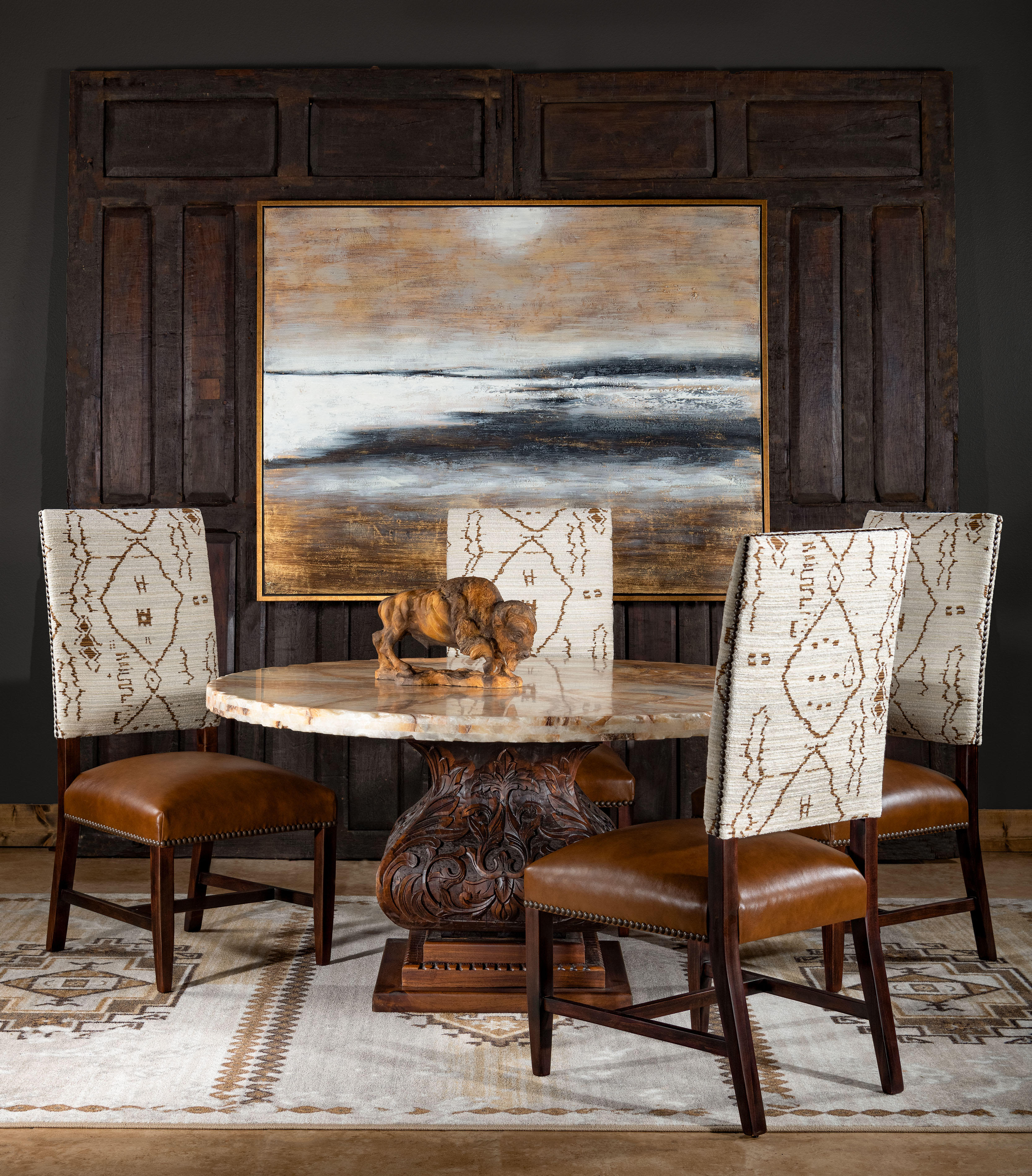 If you are searching for a luxurious modern southwestern dining chair that features a geometric, and modern inspired pattern, look no further than our Carlsbad Dining Chair. Using Poplar from the Appalachian Mountains for the frame and high-density premium cushioning on the seat and back cushion, this piece delivers the high-quality design and function that you expect from a piece of furniture that's meant to last. Eclectic influences combine for stunning results in this high-end dining chair. The seat back sports a clean, bold pattern that is as chic as it is rustic elegant. The high quality top grain leather seat cushion has a subtle distressed look, putting your guests at ease while still appearing impeccably polished. This tasteful dining room chair is truly ideal for any meal or occasion, from a small, intimate gathering to a bustling party. 100% American Made!